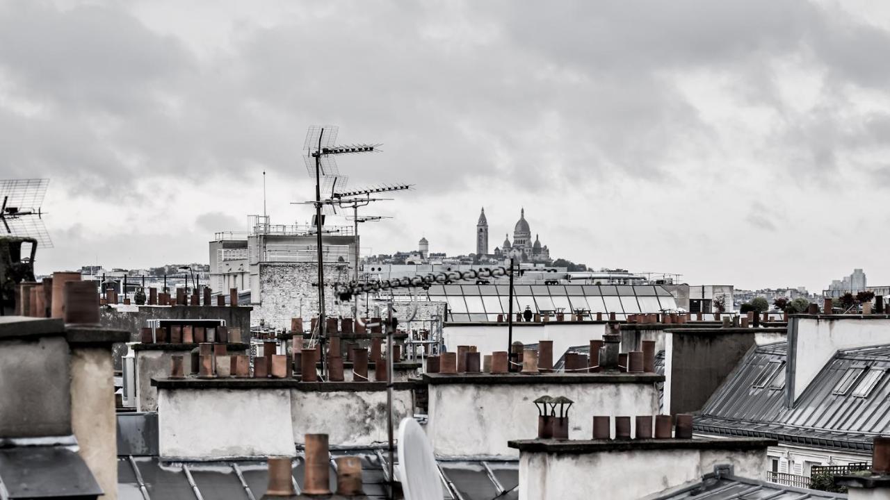 Monsieur George Hotel & Spa - Champs-Elysees باريس المظهر الخارجي الصورة View of Paris rooftops